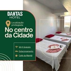 Postel nebo postele na pokoji v ubytování Dantas Hotel
