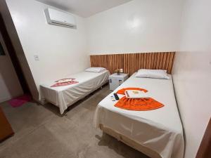Postel nebo postele na pokoji v ubytování Dantas Hotel