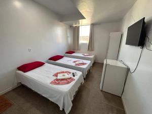 Postel nebo postele na pokoji v ubytování Dantas Hotel