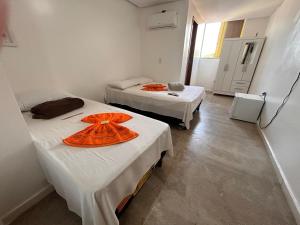 Postel nebo postele na pokoji v ubytování Dantas Hotel