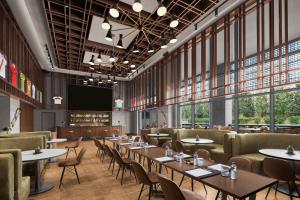 a restaurant with tables and chairs and windows at NG Enjoy in Sapanca