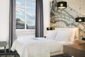 Postel nebo postele na pokoji v ubytování Le Méridien Grand Hotel Nürnberg