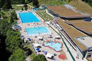 an overhead view of a large swimming pool at La Vieille Ferme de la Moussiere in Saint-Jean-dʼAulps