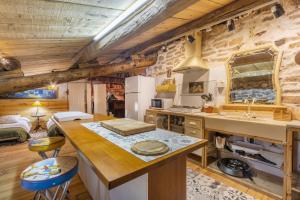 a kitchen with a counter and a sink in a room at Les Orenetes in Artesa de Segre +18 photos