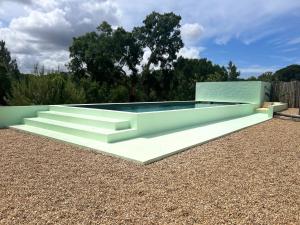 a swimming pool with stairs and a swimming poolvisorvisor at Cabanas de Melides in Melides +50 photos