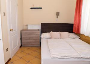 Postel nebo postele na pokoji v ubytování Makotel Apartmanház