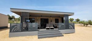 a small house in the middle of the desert at Adriaticoast Holiday Apartments- Dalmatian Dream in Drage