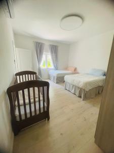 a bedroom with two beds and a window at VillaVittorio in Tarquinia +26 photos