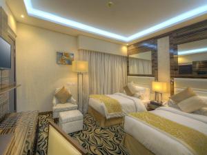 Krevet ili kreveti u jedinici u objektu Orchid Vue Hotel