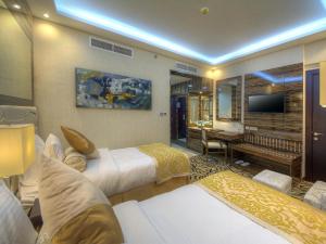 Krevet ili kreveti u jedinici u objektu Orchid Vue Hotel