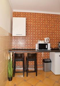 Kuchyň nebo kuchyňský kout v ubytování Makotel Apartmanház