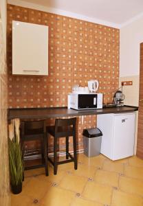 Kuchyň nebo kuchyňský kout v ubytování Makotel Apartmanház