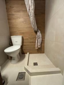 a small bathroom with a toilet in a room at Old Town Home Ioannina in Ioannina