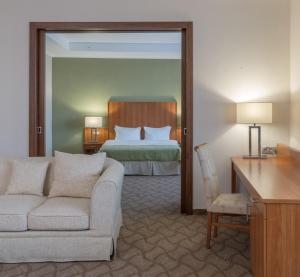 Ένα ή περισσότερα κρεβάτια σε δωμάτιο στο Hotel Duman