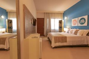 Postel nebo postele na pokoji v ubytování Tabaobí Smart Hotel + 37 fotografií