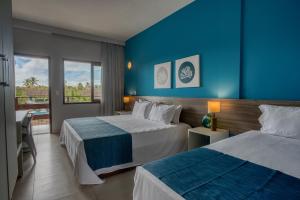 Postel nebo postele na pokoji v ubytování Tabaobí Smart Hotel