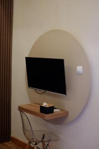 Телевизор и/или развлекательный центр в Sora Boutique Stay +20 фотографий