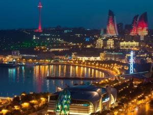 a view of a city at night with lights at Avrasya Hotel in Baku