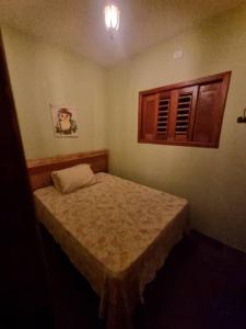 Ένα ή περισσότερα κρεβάτια σε δωμάτιο στο A melhor experiência da Serra