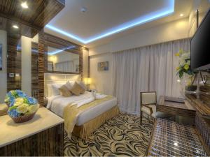 Krevet ili kreveti u jedinici u objektu Orchid Vue Hotel