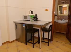 Kuchyň nebo kuchyňský kout v ubytování Makotel Apartmanház