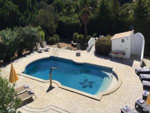 Výhled na bazén z ubytování Vivenda Carvoeiro Deluxe Luxury 7 Bedroom Villa Perfect for Larger Groups Table Tennis nebo okolí