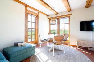 Televiisor ja/või meelelahutuskeskus majutusasutuses Objekte im Umland Lübsche Mühle