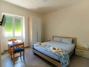 Postel nebo postele na pokoji v ubytování B&B Vigna Grande