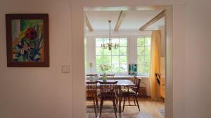 a dining room with a table and chairs at Ferienhaus Stefano in Bad Berleburg