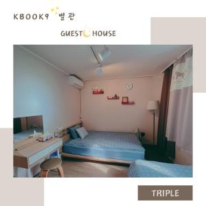 a small room with a bed and a desk at kbook9 in Seoul