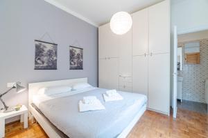 En eller flere senge i et værelse på Camogli Casa Conchiglia