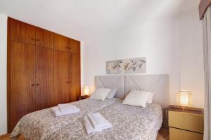 En eller flere senge i et værelse på Tenis Golfmar + 15 billeder