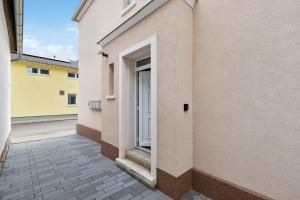 an open door of a building with a window at modern living - BASF - MA - PFALZ - 1 Gym 2 Working Spaces in Ludwigshafen am Rhein
