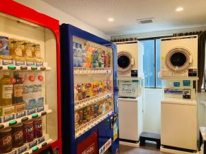 two refrigerators in a store with soda and drinks at Hotel Precia Naha Tsujimachi - Vacation STAY 17058v in Naha