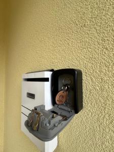 a box on the wall with a camera in it at Studio Apartman Josip in Gospić