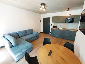 Posezení v ubytování APARTAMENTY PIASKOWE BŁĘKITNA