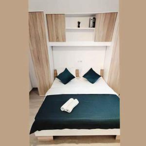 a bedroom with a bed with a towel on it at Apartment Lopar 13 in Lopar