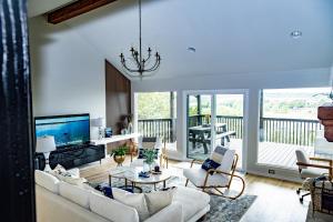a living room with a couch and a television at Lakeview Haven! Nature's Retreat with Serene Views in Lago Vista