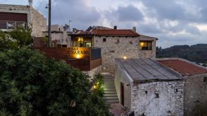 a stone house with a staircase leading up to it at Villa Charaso Giorgio - private pool by Estia in Kharasón