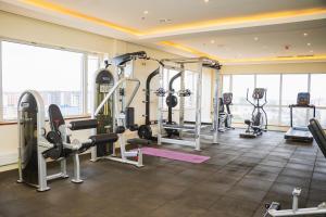 a gym with treadmills and machines in a building at Capital M - Bednbeyond, Westlands Nairobi, Kenya-Call 25472I95O319 in Nairobi