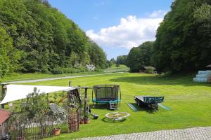 een luchtzicht op een park met een speeltuin bij Bauernhof Auerhof Ferienwohnung in Aschau im Chiemgau
