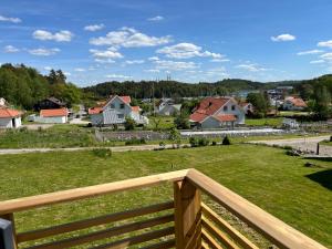 a view from the deck of a house at Stuga Tjörn/Almösund in Almösund