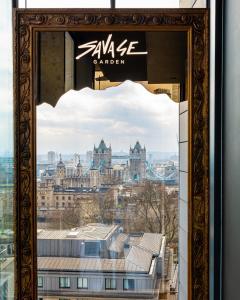 a view of the city of london from the window of a building at DoubleTree by Hilton Hotel London - Tower of London in London