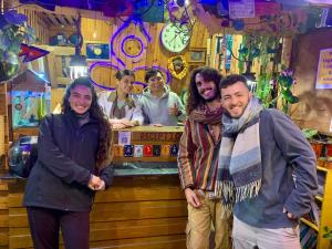 een groep mensen die voor een bar staan bij Yog Hostel- Rooftop Yoga & Backpacker Social Stay in Thamel, Kathamndu in Kathmandu
