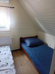Postel nebo postele na pokoji v ubytování Amelia Domek letniskowy