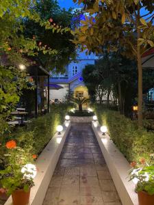 a walkway with lights in a park at night at Hotel ABC, Boutique Hotel in Pokhara in Pokhara