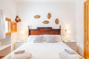 Ein Bett oder Betten in einem Zimmer der Unterkunft Marina Ses Covetes