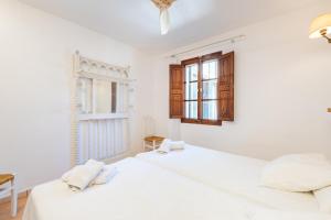 Ein Bett oder Betten in einem Zimmer der Unterkunft Marina Ses Covetes