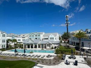 a view of a resort with a swimming pool at Luxurious Three-story Townhouse In Payne Park Village in Sarasota