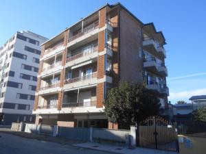 an apartment building on the side of a street at Condominio Lido in Porto Garibaldi